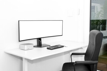 Modern workplace with computer and wi-fi router near light wall