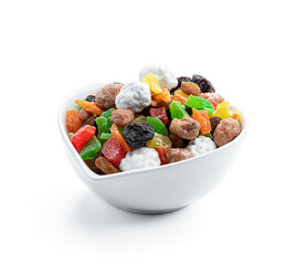 Sugar coated nuts and candied fruit in white plate isolated on white background