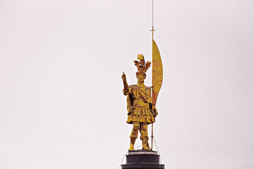 Golden statue of roman soldier St Alessandro on cathedral of Bergamo