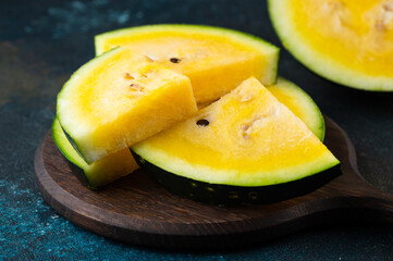 Cut yellow watermelon on table. Fresh summer food. Healthy nutrition