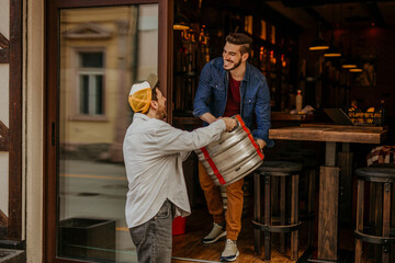 Restaurant worker receive goods from the supplier.