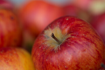Fototapeta na wymiar Red fresh bio apples in old wooden crate in summer farm on village.