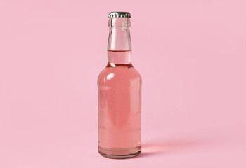 Bottle of fresh soda on pink background