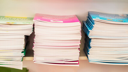 Stacks of school workbooks, educational notebooks for school education closeup. Education, back to school concept