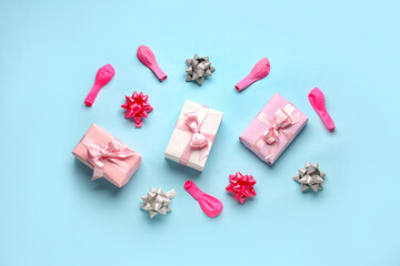 Composition with birthday gift boxes and balloons on pale blue background