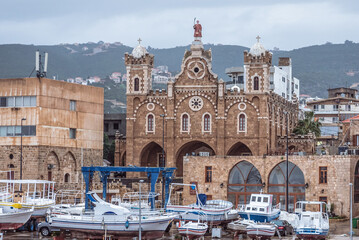 Fototapeta na wymiar View on a port and Cathedral of St Stephen in Batroun historical city, Lebanon