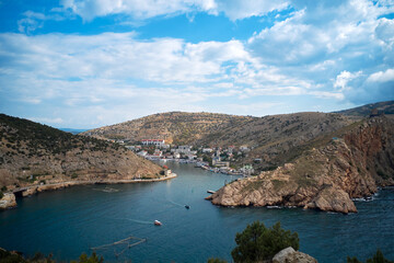 Panoramic view of the winding rocky fairway of Balaklava Bay with the anchorage of boats and...