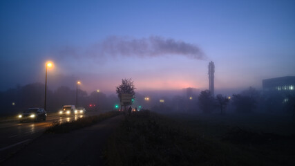 Rush hour in the industrial smoke city morning sunrise. Environmental industry. 