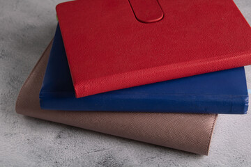 a photo of several notebooks of different colors