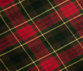 Checkered fabric, plaid. Red, black with yellow lines.