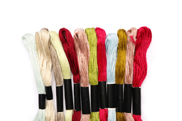 Fototapeta premium Different mouline threads isolated on white background