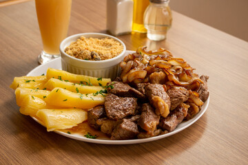 Picanha with onions with fried cassava and flour - obrazy, fototapety, plakaty