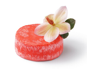Red solid shampoo bar with flower on white background