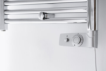 modern radiator with thermostat in domestic bathroom