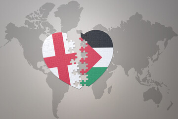 puzzle heart with the national flag of palestine and england on a world map background.Concept.