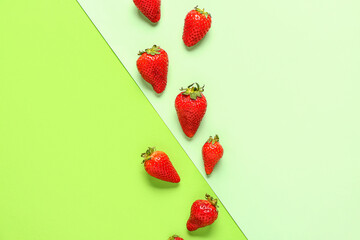 Fresh strawberries on green background