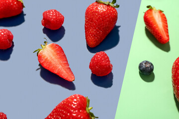 Different fresh berries on colorful background