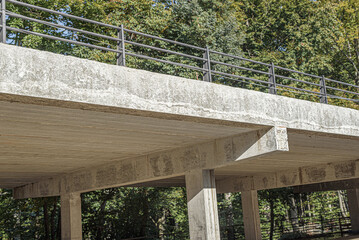 Fragment of a new automobile overpass on concrete supports. Road infrastructure.