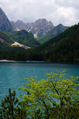 Fototapeta na wymiar Summer scenic view of Braies Lake in Dolomites mountains, Sudtirol, Italy. Lake Braies is also known as Lago di Braies. 