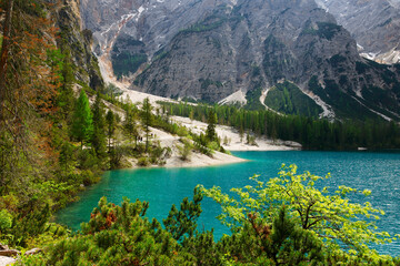 Fototapeta na wymiar Landscape view of the emerald smooth surface of Lago di Braies in the Dolomites, northern Italy, Europe