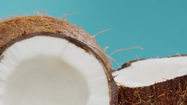 coconut coco rotating, coco oil, lemonade fresh fruits falling splashing into water aquarium or pot, splash healthy food diet freshness concept 