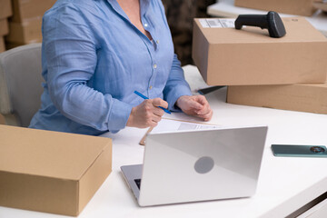 A dropshipping business featuring a laptop, shipping packages, and a retail marketplace for...