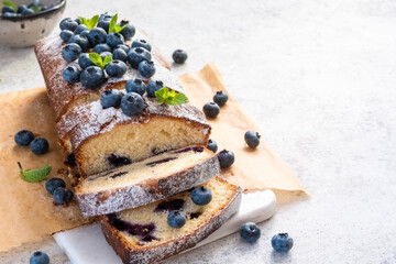 fresh blueberry loaf of bread muffin cake with mint closeup on a table