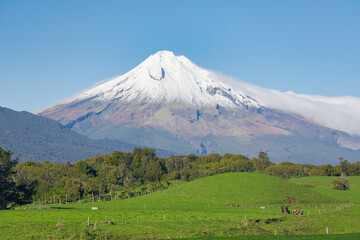 Farmland and mountain, clear blue sky