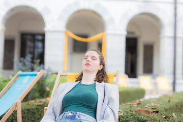 Woman breathing fresh air with a city in the background