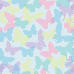 Fototapeta na wymiar Multicolored silhouettes of butterflies on a light background, seamless vector pattern