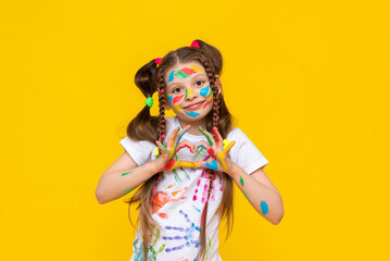 Portrait of a little girl with baby makeup and painted colorful pens, children's creativity, a child showing his dirty hands in cameras, additional drawing courses.