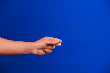Human hand on a blue background