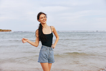 Fototapeta na wymiar woman summer holiday sand beach sea sunset vacation ocean lifestyle smile
