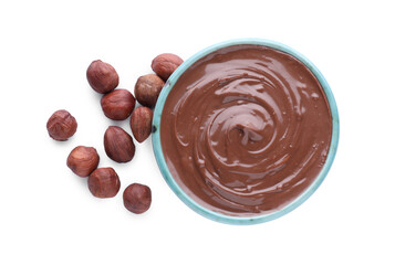 Bowl with delicious chocolate paste and hazelnuts on white background, top view