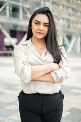 posing relaxed young woman with straight black hair, entrepreneur with modern lifestyle and beauty, model with details on her face