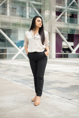 relaxed young woman with black straight hair, entrepreneur with modern lifestyle and beauty, model in business attire, fashion