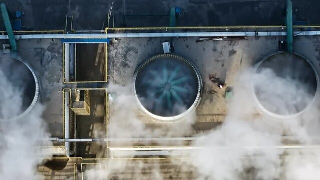 Aerial view of exhaust fan smoke pollution in industrial area. High Angle view.