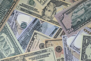 Fototapeta na wymiar Close up of prop US 100 dollar bills staniding on end.