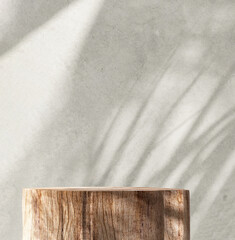 Minimal, natural log wood podium table in sunlight, palm leaf shadow in blank gray polished concrete wall for modern luxury beauty, cosmetic, organic, nature, fashion product display background 3D
