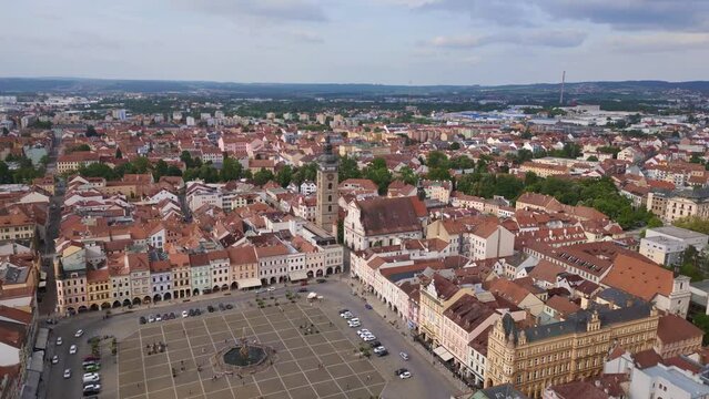 Fantastic aerial top view flight 
Fountain in the center of the historic market square. Budweis Budejovice old town in Czech Republic, summer of 2023. 
fly reverse drone
4K uhd footage.