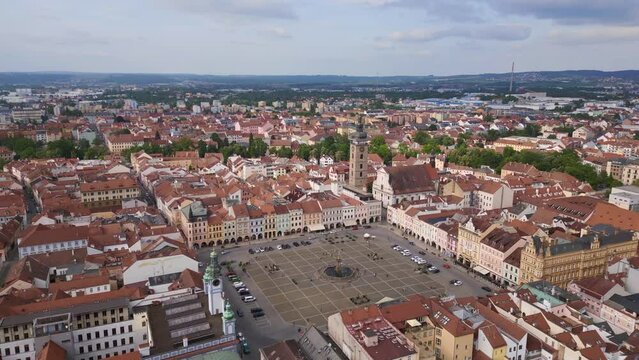 Fountain in the center of the historic market square. Amazing aerial top view flight 
Budweis Budejovice old town in Czech Republic, summer of 2023. panorama overview drone
4K uhd footage.