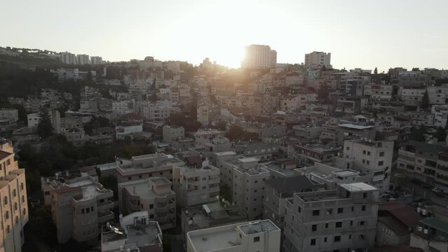 Middle eastern city drone shot of homes aerial war zone conflict
