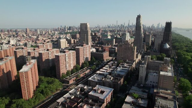 NYC skyline at golden hour, 4K drone shot. Harlem and Upper West Side.