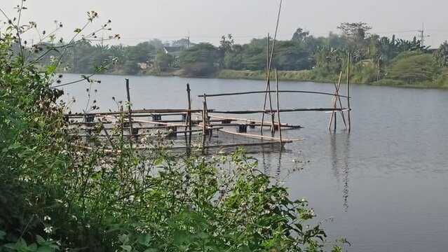 fish farming using pots or nets in the middle of the river