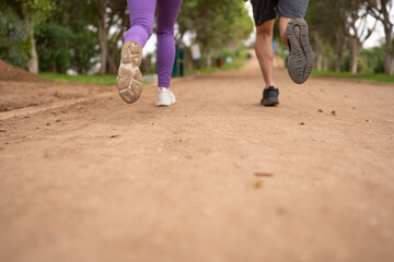Fototapeta na wymiar Couple jogging, in the park.