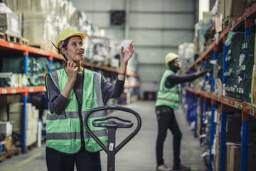 Warehouse supervisor uses two way radio for seamless communication and connectivity with staff...