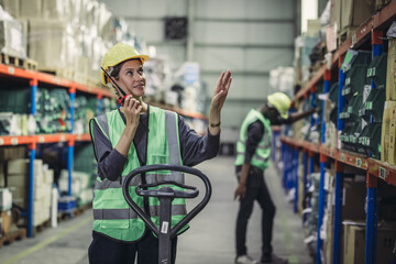Warehouse supervisor uses two way radio for seamless communication and connectivity with staff...