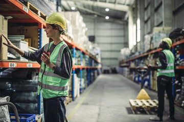 Warehouse supervisor uses two way radio for seamless communication and connectivity with staff...