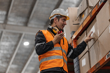 Warehouse supervisor uses two way radio for seamless communication and connectivity with staff...