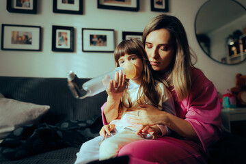 Girl Using a Spacer with Asthma Inhaler for Respiratory Disease. Mom helping her beloved daughter to get over asthma attack
 - obrazy, fototapety, plakaty
